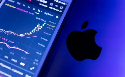 Mobile screen displaying finance and stock trading charts next to a laptop with an Apple logo, representing native iOS app development.